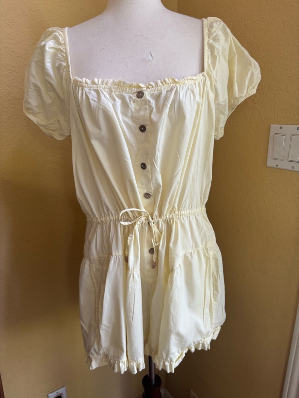 Free People sight for sore eyes butter yellow romper with ruffle detail. Large